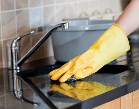 Professional home cleaner in a Soho apartment living room